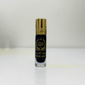 Black Musk perfume oil bottle with gold cap and Arabic text on white background