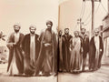 Illustration of Shia Islamic scholars and men walking on a street, wearing traditional robes and turbans.