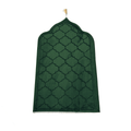 Green Islamic prayer mat with geometric pattern and pointed arch design