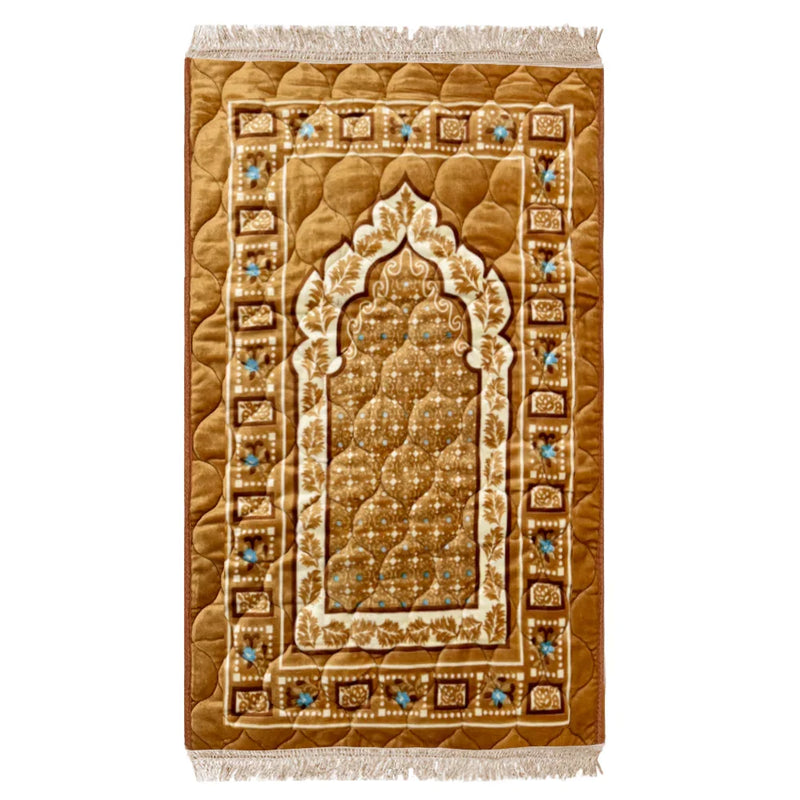Gold prayer mat with Islamic geometric patterns and floral accents, featuring a central arch design.