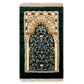 Green prayer mat with ornate Islamic floral patterns and gold arch design